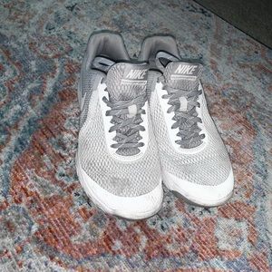 White/gray Nike running shoes
